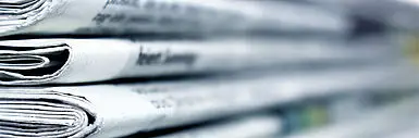 Newspapers stacked on top of each other